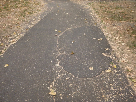 Hard surface trail - cracks across the trail - patching on the blacktop - this is common throughout the park